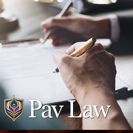 man signing legal documents