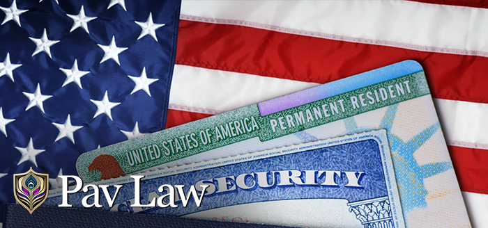 US green card and social security card over US flag